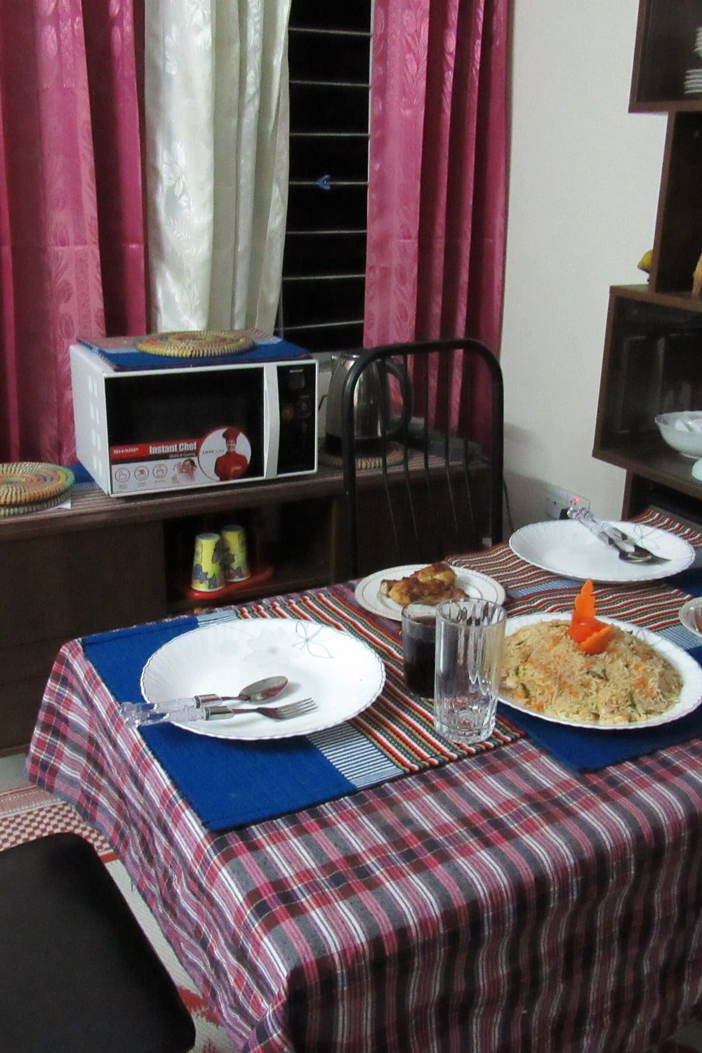 Dining table with a runner and simple centerpiece